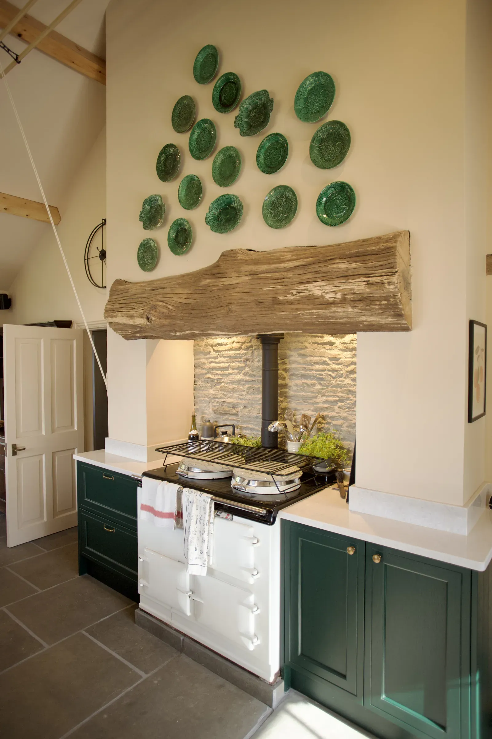 Aga set into an alcove with a thick timber beam above, cut from a tree that fell on the property